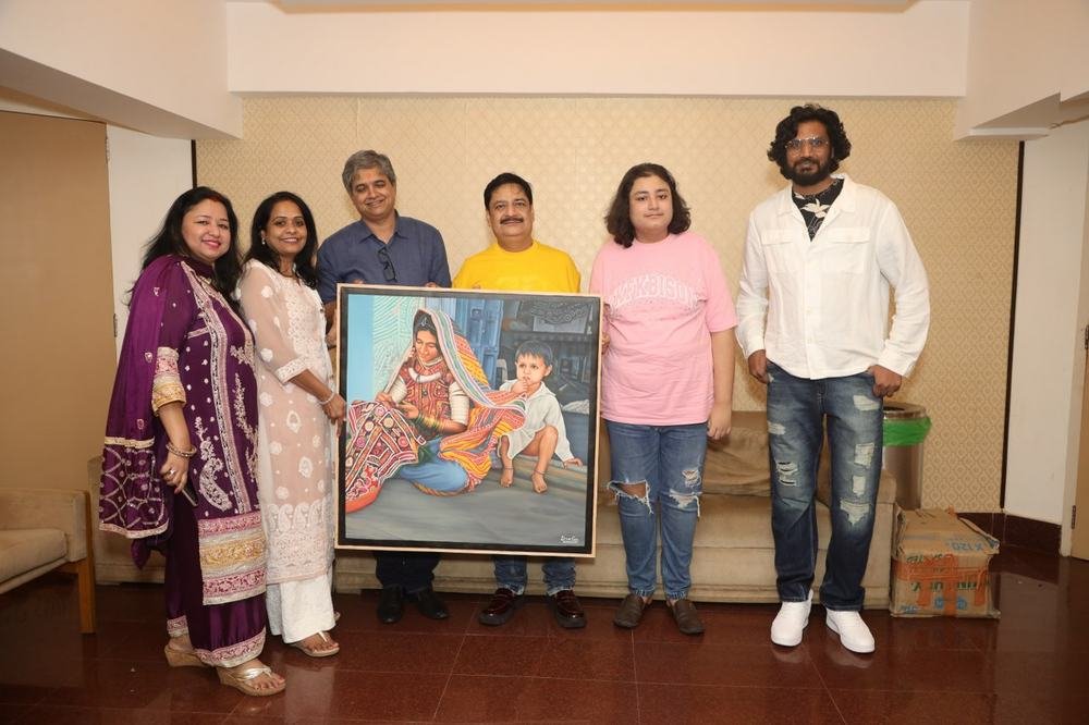A framed masterwork handed over